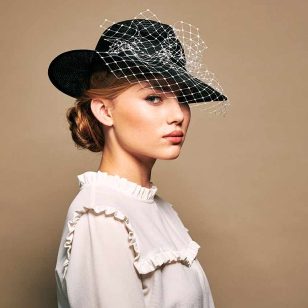 ROSIE OLIVIA HULA QUIRKY TRILBY WITH A IVORY VEIL ADORNED WITH TINY PEARLS.